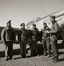 Col. Benjamin O. Davis at Ramitelli, Italy, March, 1945, presenting war bond for best kept A/C