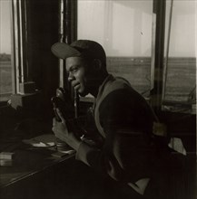 Sgt. William P. Bostic, 301st F.S. in control tower, March 1945