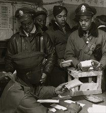 Black fighter pilot series: "Escape kits" (cyanide) being distributed to fighter pilots at air base in southern Italy, 1945