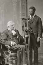 Stephens, Hon. Alexander Hamilton of Georgia (Vice-President of the Confederacy) (with colored man attendant)