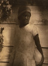 Young Negro girl holding bag