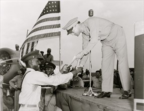 African American receiving a piece of paper, a military award, Tuskegee Army Air Field, Alabama