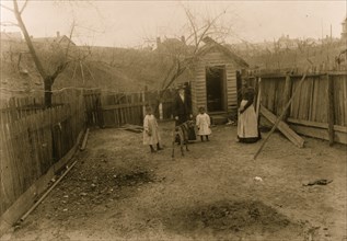 African American family standing in a yard in Georgia