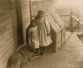 Two African American children with a dog in Georgia