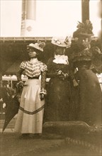 Three African American women, full-length portrait, standing, at the State Fair at Saint Paul, Minn.