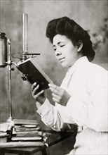 African American Woman reading a book