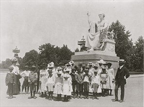 Group of school children in front of statue of George Washington, Washington, D.C.