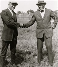 Tut Jackson (left) and Jack Johnson shaking hands