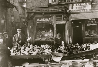 People shopping for shoes at shop on Maxwell Street, Chicago, Illinois
