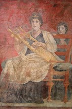Seated woman playing a kithara