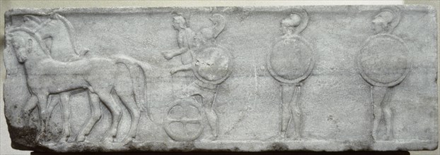 Base of funerary Kouros. Four-horse chariot and hoplites.