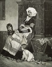 Mother with her two children at home.