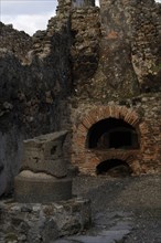 Pistrium. Oven for bread, old-mill of grain and the fireplace of the oven.