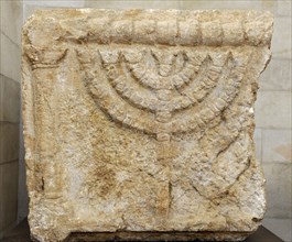 Stone lintels decorated with the Seven-Branched Menorah synagogue at Eshtemoa.