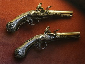Pair of flintlock pistols.