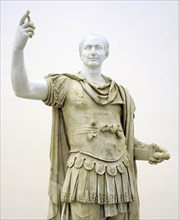 Figure in miliary uniform, with a modern head of Julius Caesar.