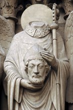 Christian martyr Saint Denis holding his head.