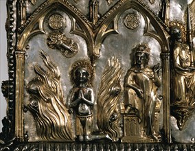 Reliquary casket of Saint Cucuphas. Wooden gilded silver. 14th Century. Detail. Saint Cucuphas in a bonfire from where demons are fleeing. Over the Saint, the Hand of God (dextera domini) while Maximi...