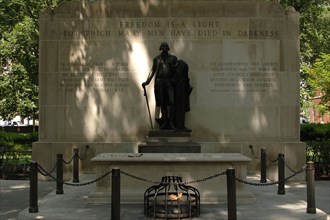 Tomb of the Unknown Revolutionary War Soldier and statue of George Washington.