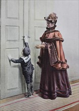 Woman and little boy are standing in front of the door