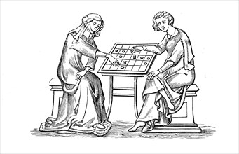Woman and young man playing a board game