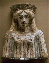 Bust of a woman or goddess wearing a polos and polychrome clothes