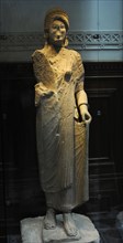 Statue of a young woman with linen dress