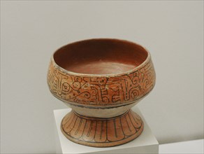 Cup with schematic and geometric decoration