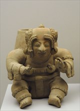 Vessel in the shape of a sitting human figure