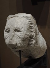 Fragment of a block in a shape of a lion