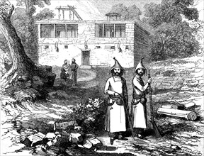 Kurds of the warrior caste in front of a dwelling of the Nestorians