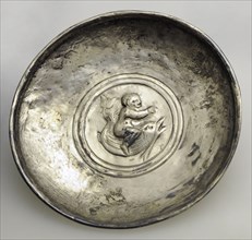 Roman silver plate decorated with a child on a dolphin.