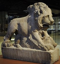 Statue of a lion killing a boar, symbol of death.