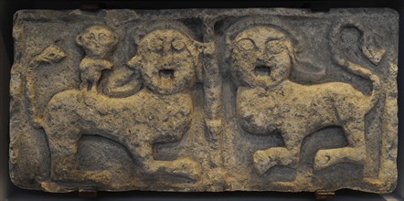 Relief. Pair of lions and a monkey.