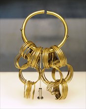 Gold bracelet with hanging spirals
