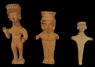 Male and female terracottas in a prayerful attitude