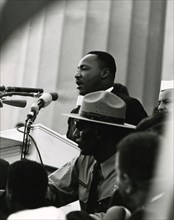 MLK, Jr. speaking to the crowd on the steps of the Lincoln Memorial