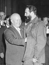 Soviet Premier Nikita Khrushchev (left) gives Cuban Premier Fidel Castro an affectionate pat on the back as the latter arrives for dinner at the Soviet legation. Both were in New York City for the 15t...