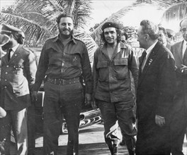Cuban Premier Fidel Castro (left), Ernesto 'Che' Guevara, Cuban National Bank President (center), and Soviet First Deputy, Premier, Anastas Mikoyan (right) are shown together in the garden of the hous...