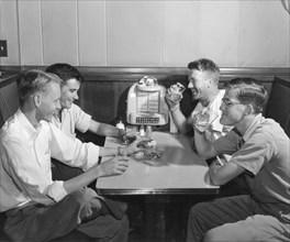 Four Men Drink Beer By Jukebox
