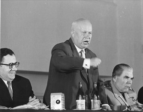 Soviet Premier Nikita Krushchev (center) shakes his fist, as he launches into a bitter tirade at his farewell press conference 5-18-60, after he had attended the Summit conference. At his right is Soc...