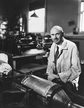 Dr. Robert Goddard works on a rocket at his shop in Roswell, New Mexico. Dr. Goddard is recognized as the 'Father of American Rocketry.' October 1935.