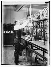 1920 -  Treasury, Internal Rev. Chemist G.F. Beyertesting bootleggers' booze.