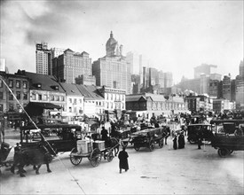 Traffic waits to cross Manhattan Bridge in the early 1900s. New York City.