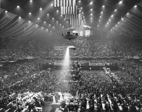 Overall view of the Republican Party's National Convention at the International Amphitheatre in Chicago, Ill in 1960. Hanging in the background are photographs of President Eisenhower, President Abrah...