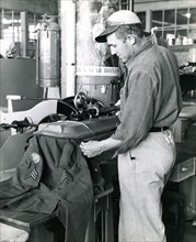 August 1943 - Prisoner at the U.S. Penitentiary at Alcatraz does War Work by repairing and dry cleaning uniforms for the Army Quartermasters Department.