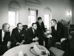 January 28, 1964 -- Civil Rights leaders (l to r) Roy Wilkins, James Farmer, Dr. Martin Luther King, Jr. and Whitney Young meet with President Lyndon B. Johnson at the White House, WAshington, DC, Abb...