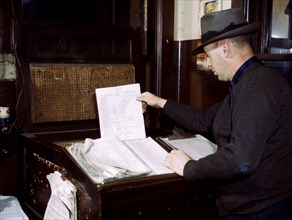 Switch lists coming in by teletype to the hump office at a Chicago and Northwestern [i.e. North Western] railroad yard, Chicago, Ill. December 1942.