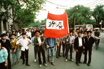 5/19/1989 - Students demonstrate for democracy on a busy Shanghai street, during a US 7th Fleet goodwill visit..
