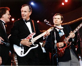 President Bush and Lee Atwater Play the Guitar at the Celebration for Young Americans at the DC Armory 1 20 1989.